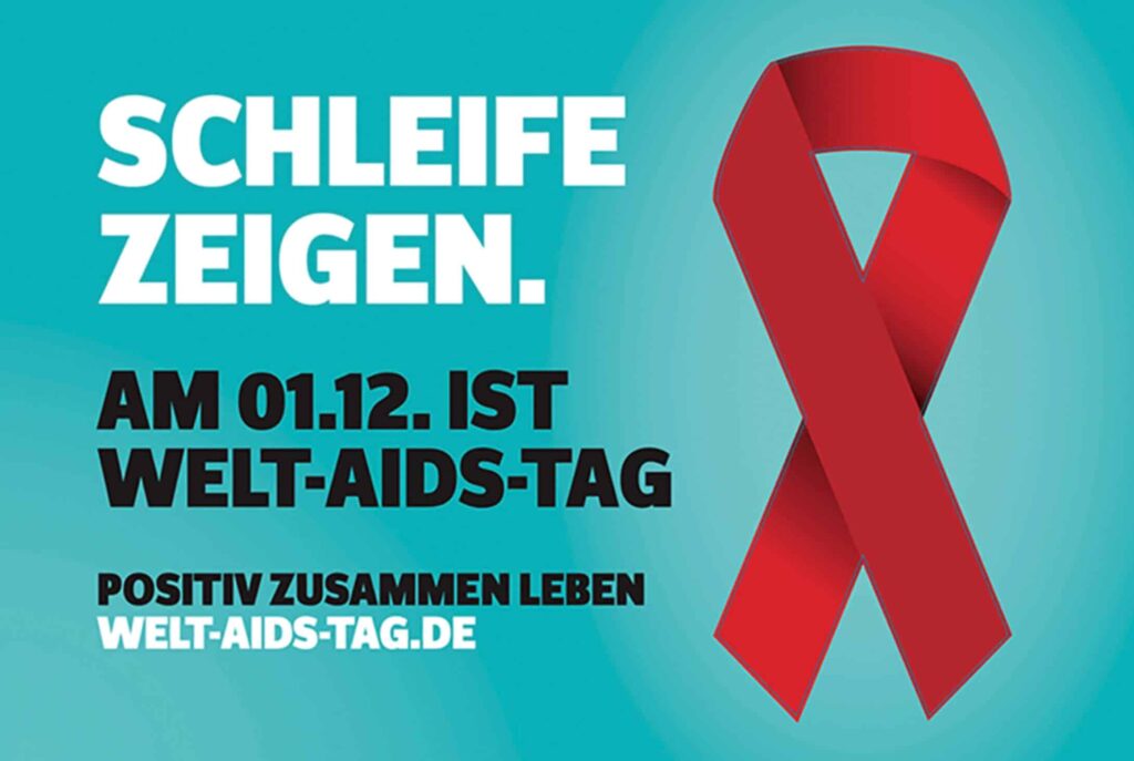 Zu sehen ist ein Plakat mit dem Motto "Schleife zeigen – am 01.12. ist Welt-Aids-Tag"